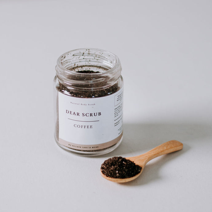 coffee body scrub with wooden spoon and neutral background